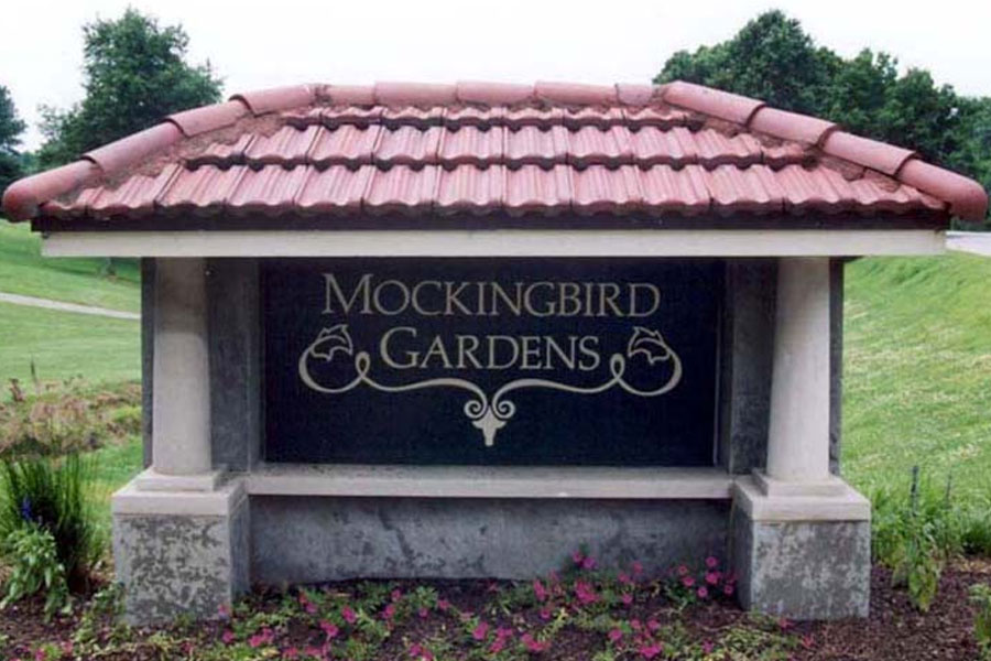 The entrance sign for Mockingbird Gardens